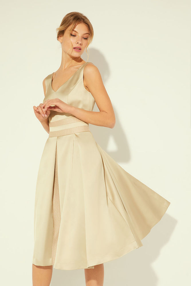 Picture of Dress in heavy satin with a stylized bodice and pleated skirt BEIGE